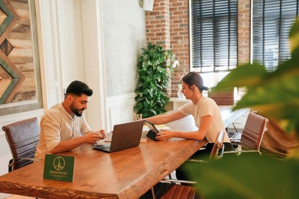 A 2-person service crew loading their van at the start of the day