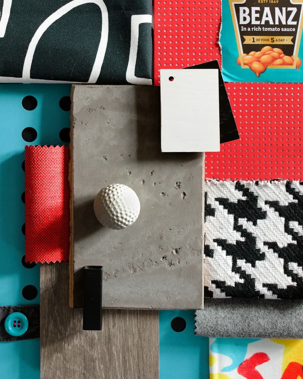 A table covered in fabric samples for an interiors project