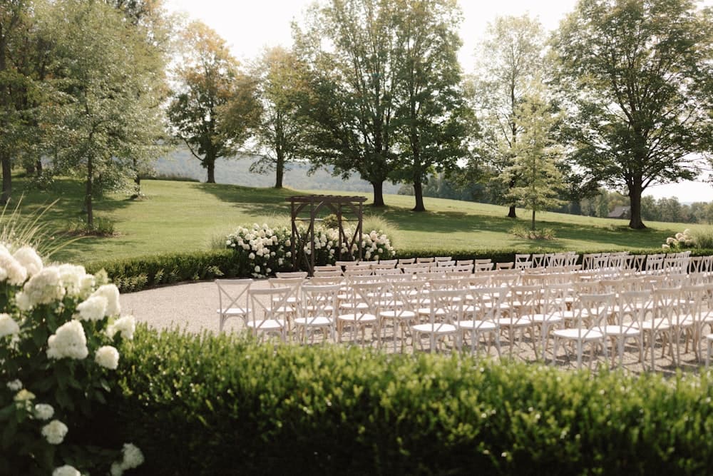 Rows of chairs set for an outdoor ceremony