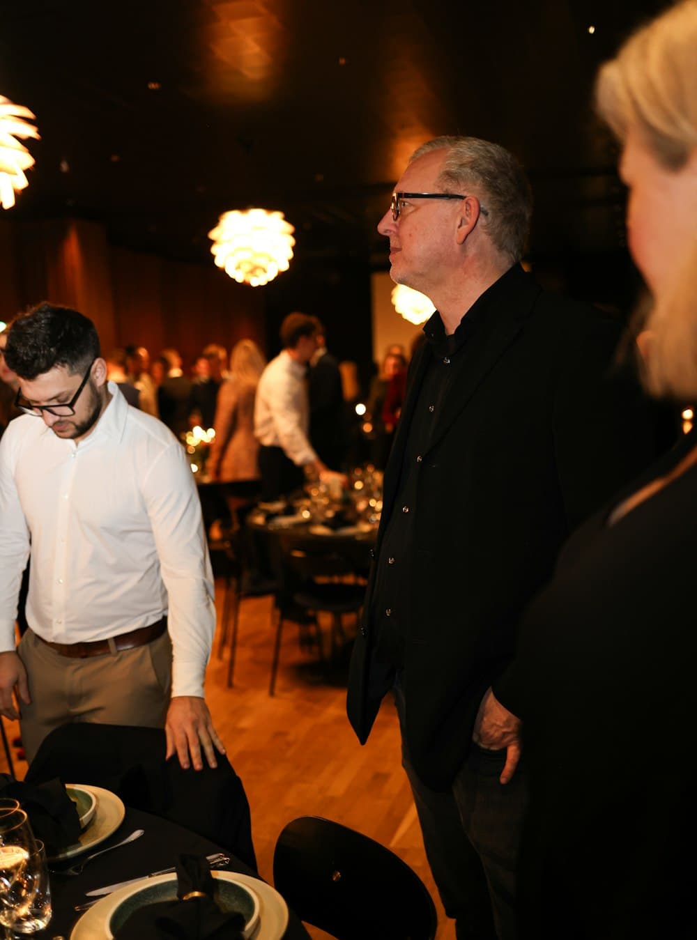 Guests gathered at a formal event in the evening