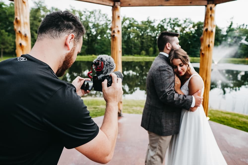 A photographer holding a camera at work