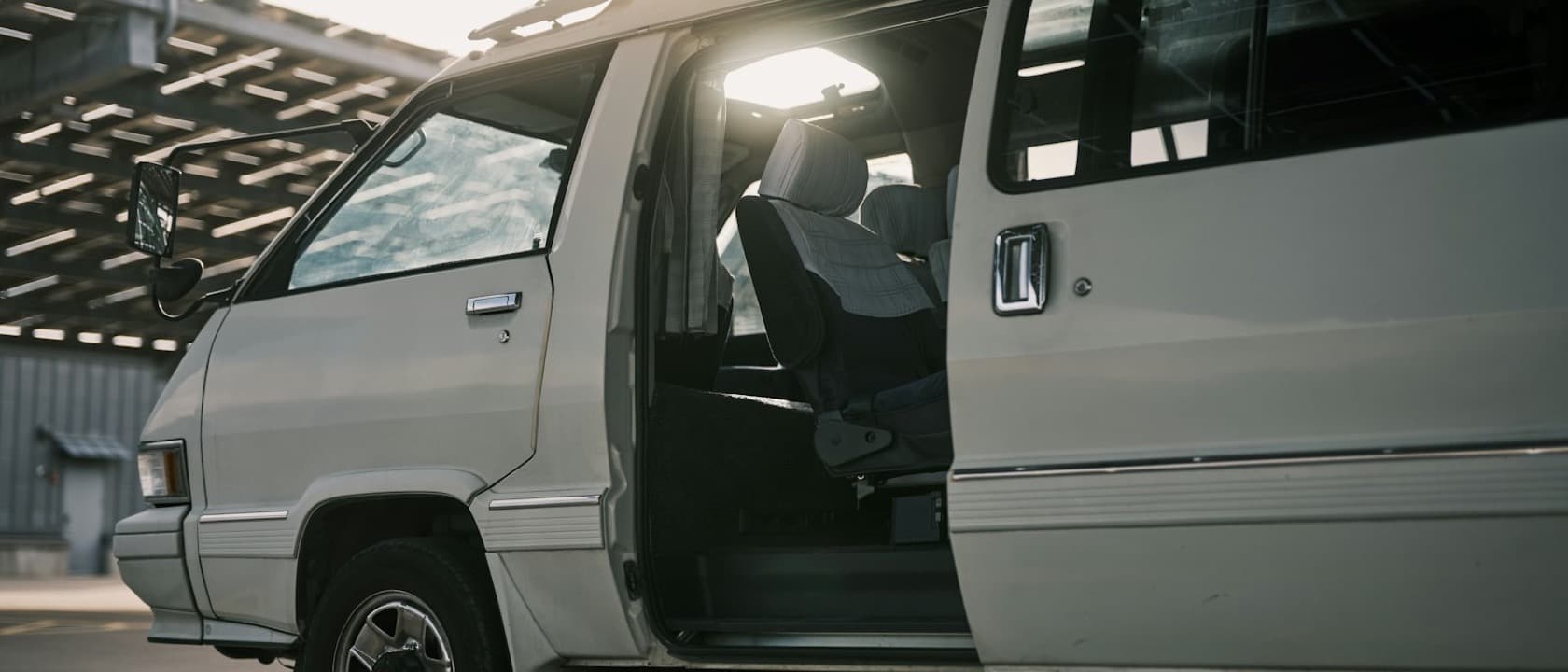 A white van parked with its door open