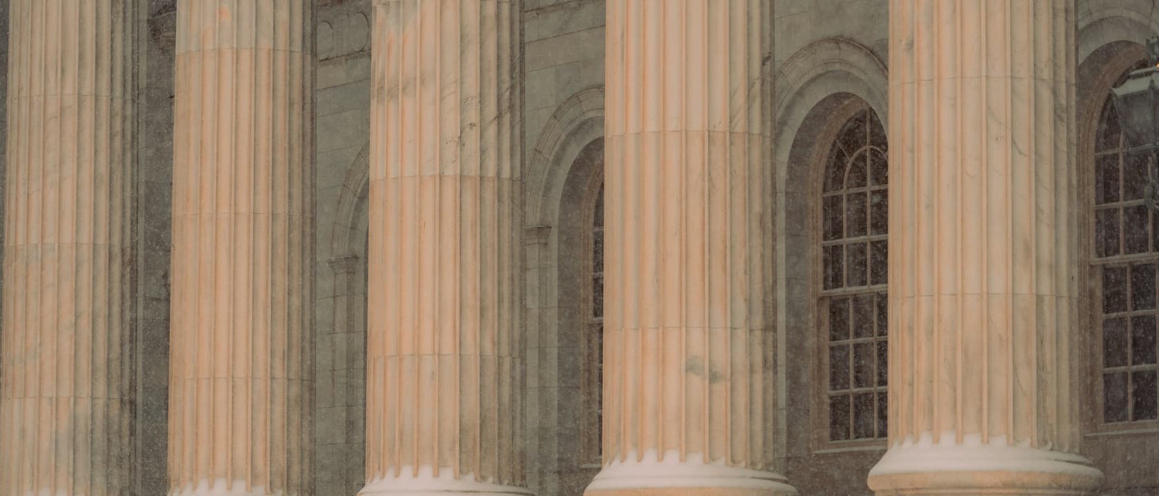 Courthouse columns and arched windows in winter light