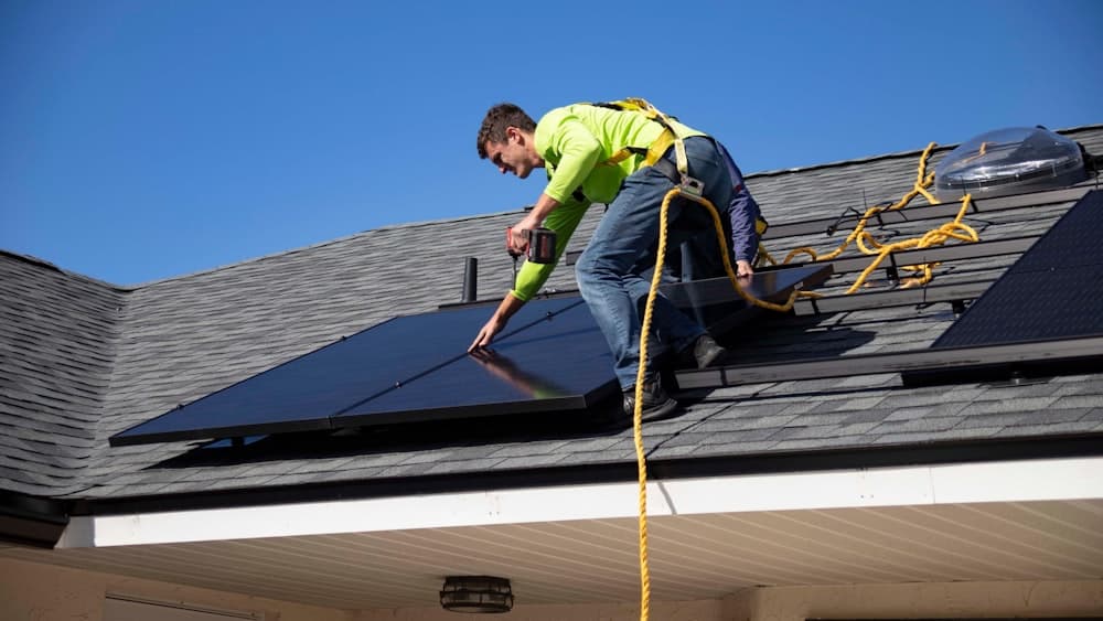 A technician walking a roof during a site survey
