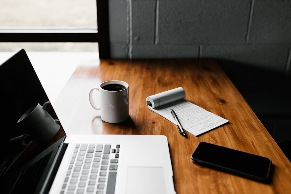 A person reading email over coffee before the day starts