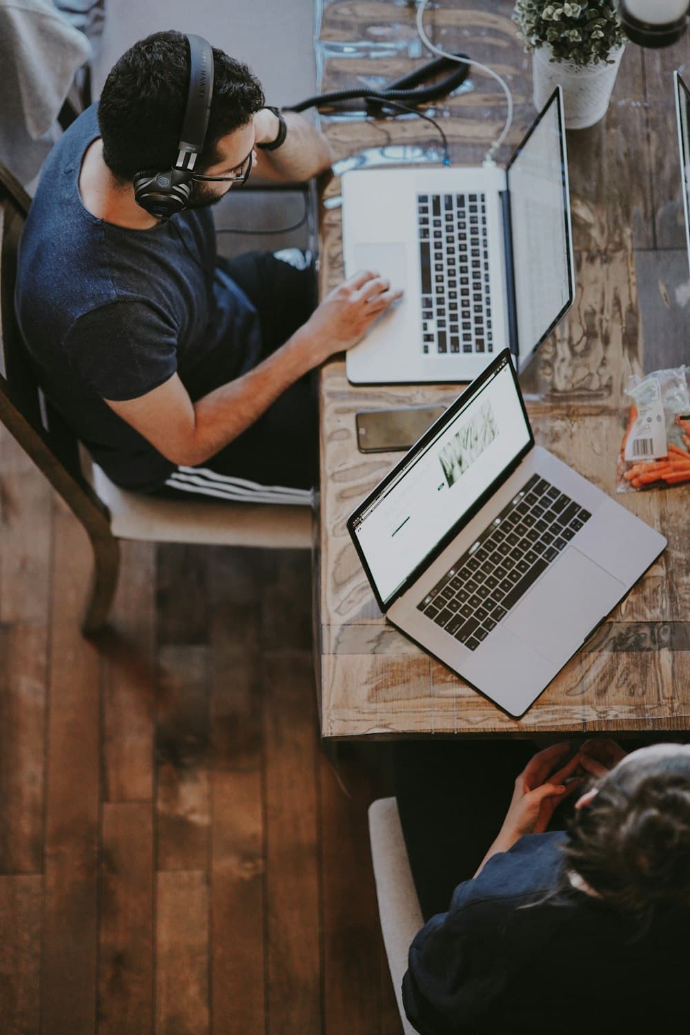 A freelancer at a shared table seen from above
