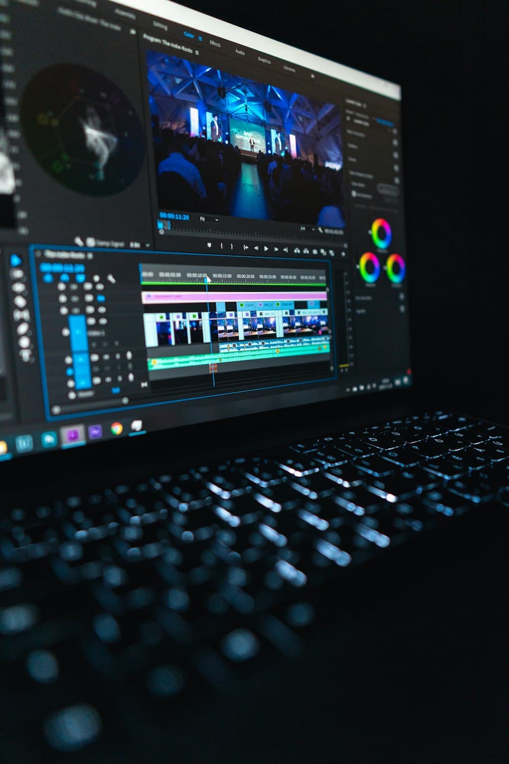 An editing timeline glowing on a laptop late at night